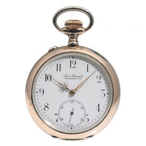 German silver open faced watch with a silver chain Circa 1909