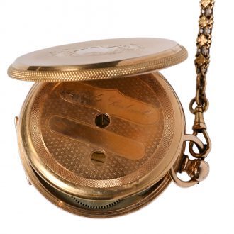 Swiss 18 carat gold open faced lever watch with chain Circa 1900