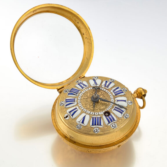 A gilt pocket watch with very thick relief case Circa 1715 A gilt pocket watch with very thick relief case Circa 1715