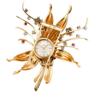 Swiss gold, sapphire, and diamond-set brooch watch Circa 1960