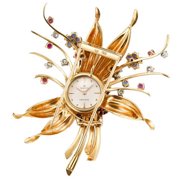 Swiss gold, sapphire, and diamond-set brooch watch Circa 1960