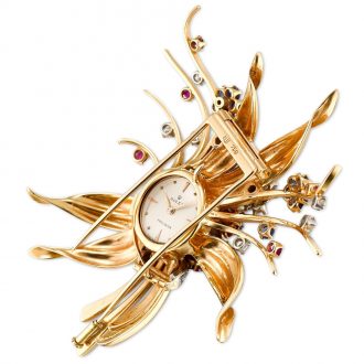 Swiss gold, sapphire, and diamond-set brooch watch Circa 1960