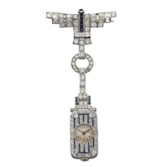 Swiss lapel watch with articulated integral diamond and ruby-set brooch Circa 1910