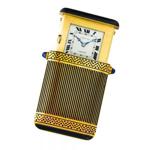 Elegant French gold and enamel concealed travel clock Circa 1925