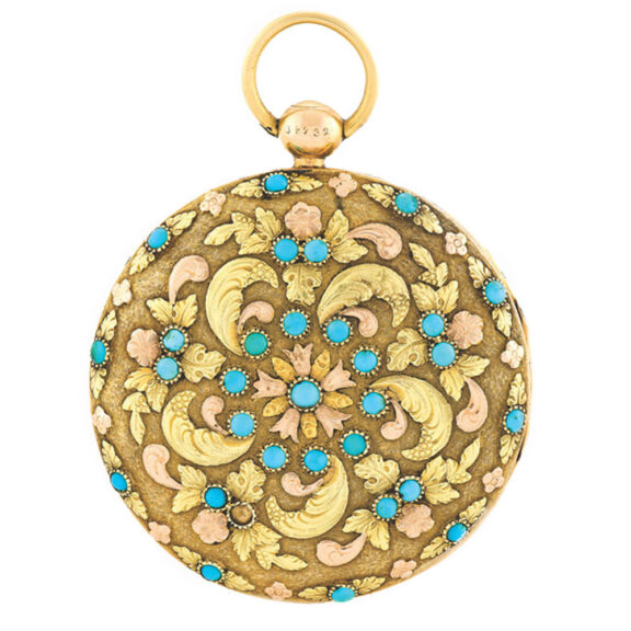 The fixed back is decorated with turquoises and applied varicoloured gold foliage and flowers forming a large rosette The fixed back is decorated with turquoises and applied varicoloured gold foliage and flowers forming a large rosette