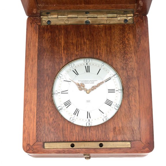 French brass open faced watch in wooden display case Circa 1886