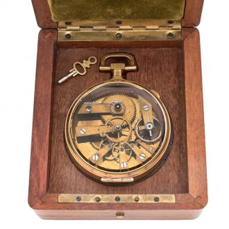 French brass open faced watch in wooden display case Circa 1886