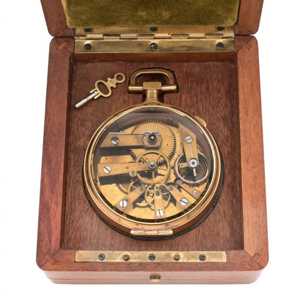 French brass open faced watch in wooden display case Circa 1886 French brass open faced watch in wooden display case Circa 1886