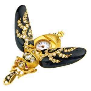 Swiss gold, enamel, and diamond set form watch Circa 1900