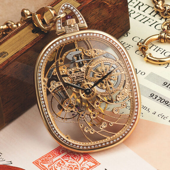 Swiss ellipse shaped skeletonized diamond and emerald set dress watch Circa 1996