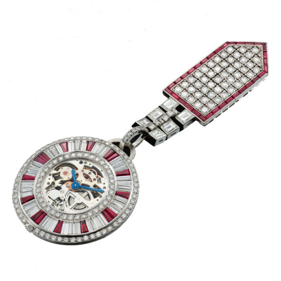 Swiss platinum, diamond and ruby set lapel watch Circa 1972 Swiss platinum, diamond and ruby set lapel watch Circa 1972