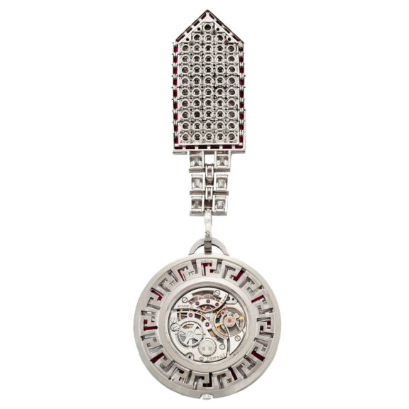 Swiss platinum, diamond and ruby set lapel watch Circa 1972 Swiss platinum, diamond and ruby set lapel watch Circa 1972