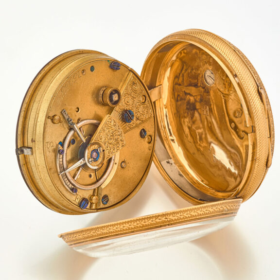 Front bezel opened by depressing the button at the gold pendant. Front bezel opened by depressing the button at the gold pendant.