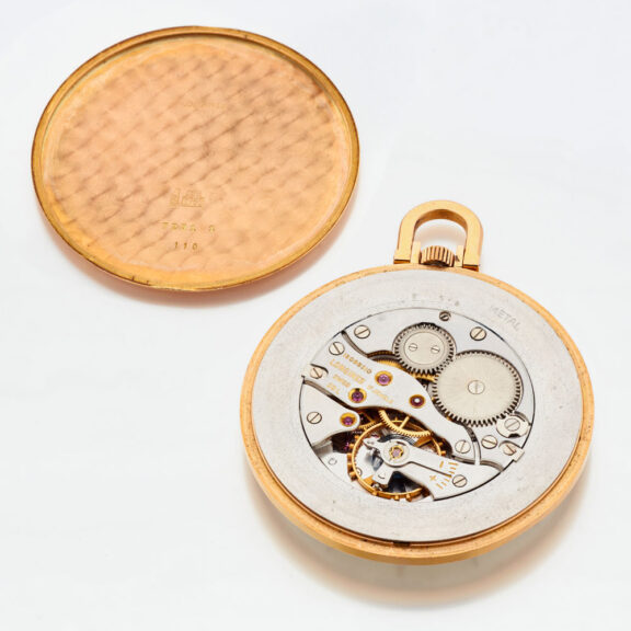 Fine Swiss 18 carat gold thin open faced watch Circa 1960 Fine Swiss 18 carat gold thin open faced watch Circa 1960