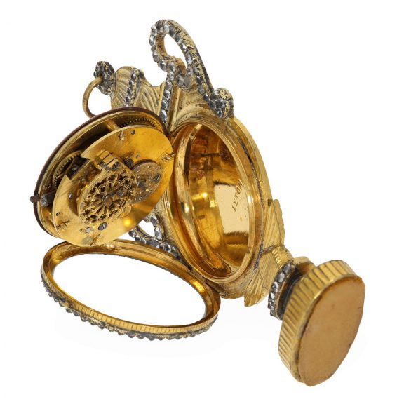 French gilt brass pendant form watch with urn shape Circa 1820 French gilt brass pendant form watch with urn shape Circa 1820