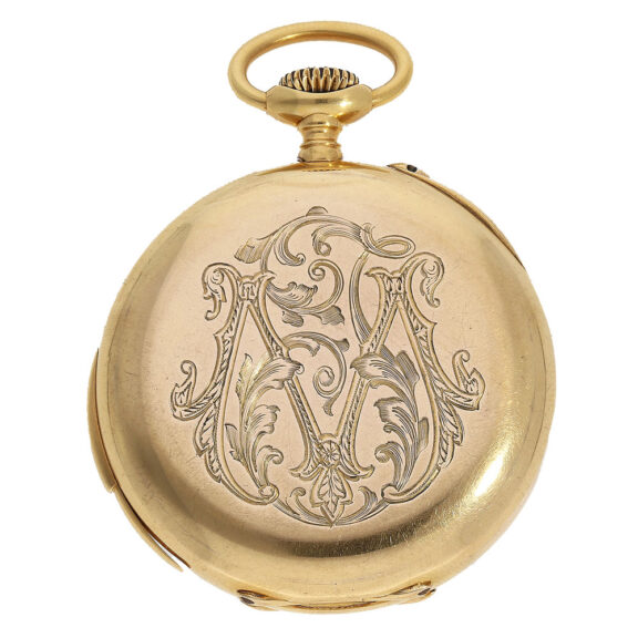 This watch has an open face case with an engraved monogram on the back This watch has an open face case with an engraved monogram on the back