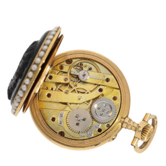 The movement has a cylinder escapement with crown winding and wolf's teeth
