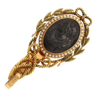 Chatelaine with high quality and extremely finely cut hardstone cameos (probably layered agate), red brown base, raised black cameo and surrounded by oriental pearls