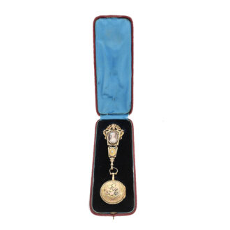 The watch with associated gold enamel chatelaine in the original box