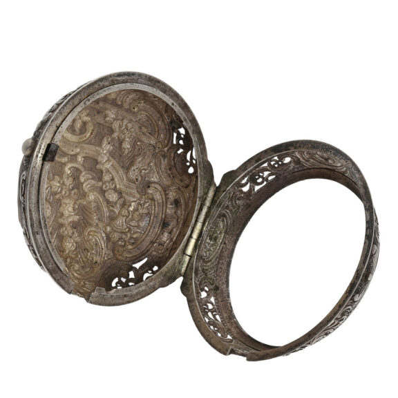 The outer case of this watch with a full hunter double case housing is beautiful repoussé with fine sound openings and the inner case is pierced The outer case of this watch with a full hunter double case housing is beautiful repoussé with fine sound openings and the inner case is pierced