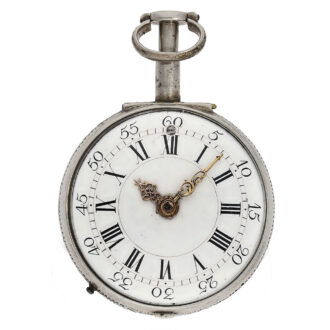 The white enamel dial with Roman numerals for the hours and Arabic numerals for the minutes and red gold hands