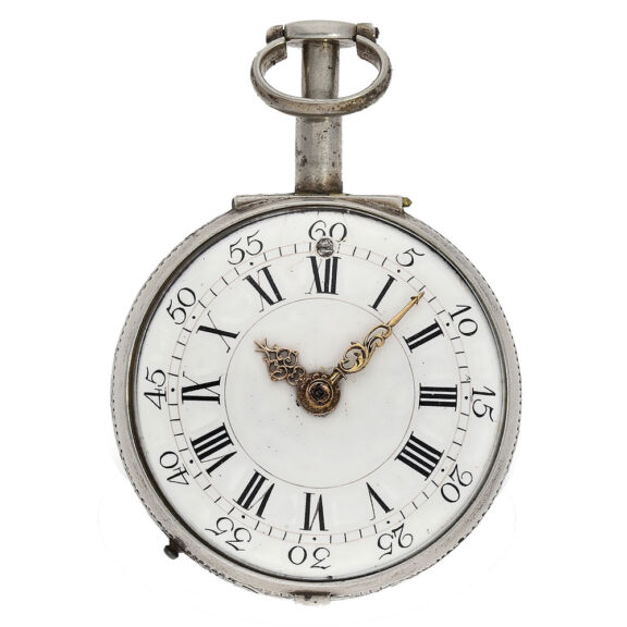 The white enamel dial with Roman numerals for the hours and Arabic numerals for the minutes and red gold hands The white enamel dial with Roman numerals for the hours and Arabic numerals for the minutes and red gold hands