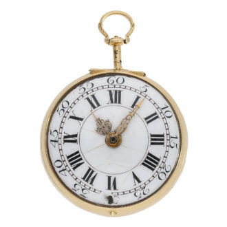 The white enamel dial is adorned with Roman numerals for the hours, Arabic numerals for the minutes, and gold hands