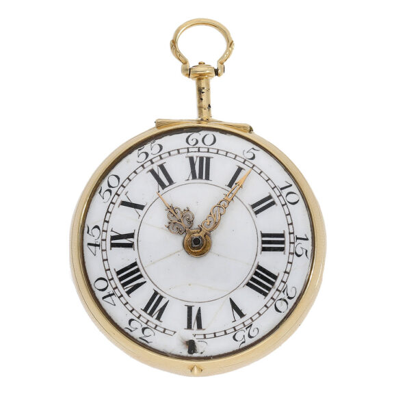 The white enamel dial is adorned with Roman numerals for the hours, Arabic numerals for the minutes, and gold hands The white enamel dial is adorned with Roman numerals for the hours, Arabic numerals for the minutes, and gold hands