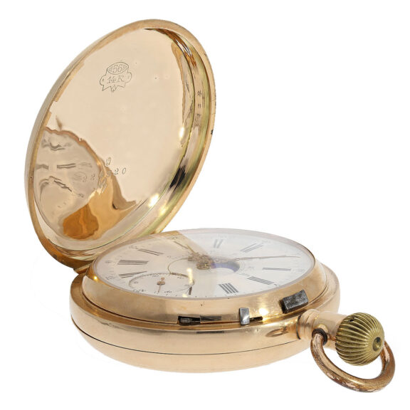 On the front of the watch, a white enamel dial displays the phase and age of the moon, while red gold hands indicate the time On the front of the watch, a white enamel dial displays the phase and age of the moon, while red gold hands indicate the time