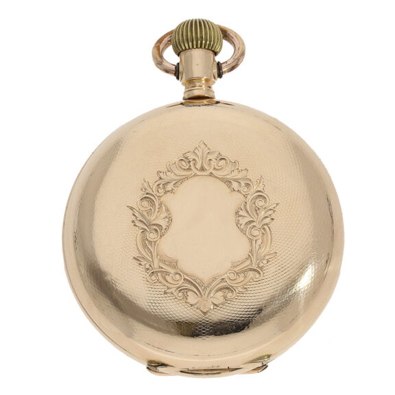 The watch is housed in a 14 carat gold case that has been glazed, engine turned and engraved The watch is housed in a 14 carat gold case that has been glazed, engine turned and engraved
