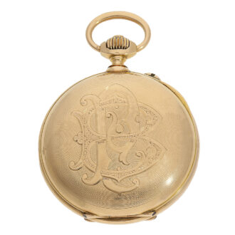 This particular pocket watch boasts a design, featuring an 18 carat gold "á-goutte" (waterdrop shape) open faced engine turned case numbered No.19681 and featuring factory glazing, with a monogram engraved on the back