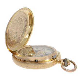 The glazed champlevé enamel dial is a work of art in its own right. It features an outer ring with Roman numerals for the hours, a subsidiary dial at six o'clock with Arabic numerals for the minutes and blued steel hands