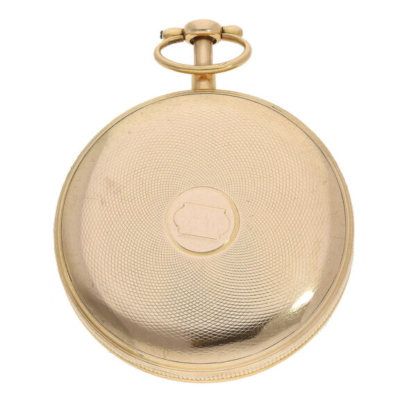 The open faced case of the watch is made of 20 Carat gold, adorned with intricate engine turning and bearing a French 20 Carat gold hallmark The open faced case of the watch is made of 20 Carat gold, adorned with intricate engine turning and bearing a French 20 Carat gold hallmark