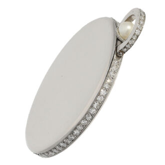 Crafted from platinum, the open faced case is hallmarked twice with the French Platinum hallmark (dog's head) and the rim and bracket are adorned with diamonds