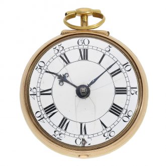 The original white enamel dial has an outer ring with black Arabic numerals for the minutes, an inner ring with black Roman numerals for the hours and original iron hands