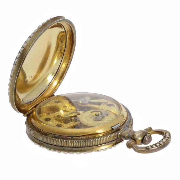 The Fleurier movement is glazed and fire gilt, has a mock pendulum and an anchor escapement The Fleurier movement is glazed and fire gilt, has a mock pendulum and an anchor escapement