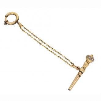 The watch comes with a particularly beautiful gold key with pearl trimmings on a golden chain The watch comes with a particularly beautiful gold key with pearl trimmings on a golden chain