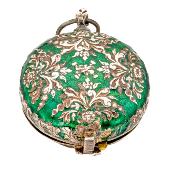 Decorative silver and enamel pill box in watch form Circa 1650