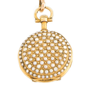 Swiss pendant watch with a detachable gold and pearl set long chain Circa 1900
