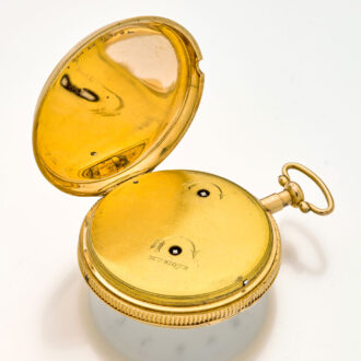 The case back with an engraving of a camp with a tent and ribbed middle
