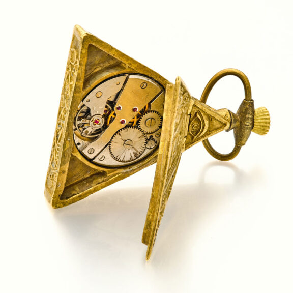 Swiss brass triangular keyless Masonic form watch Circa 1960 Swiss brass triangular keyless Masonic form watch Circa 1960