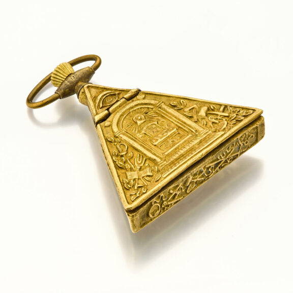 Swiss brass triangular keyless Masonic form watch Circa 1960 Swiss brass triangular keyless Masonic form watch Circa 1960