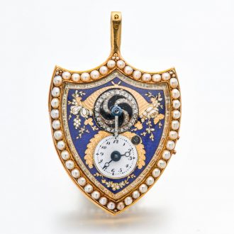 Swiss gold shield shaped watch with visible balance Circa 1800