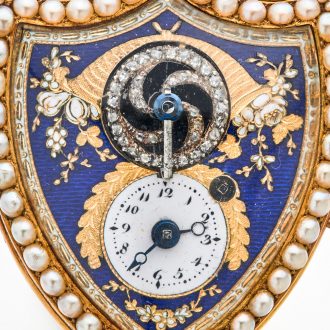 Swiss gold shield shaped watch with visible balance Circa 1800