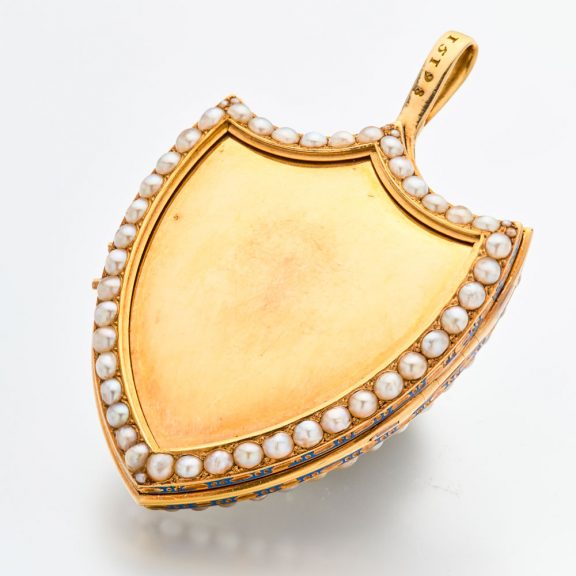Swiss gold shield shaped watch with visible balance Circa 1800 Swiss gold shield shaped watch with visible balance Circa 1800