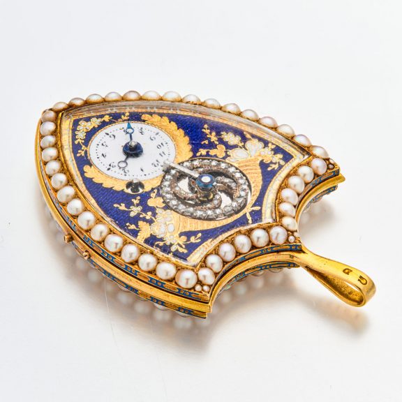Swiss gold shield shaped watch with visible balance Circa 1800 Swiss gold shield shaped watch with visible balance Circa 1800