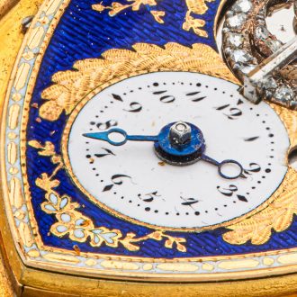 Swiss gold shield shaped watch with visible balance Circa 1800