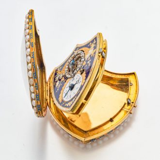 Swiss gold shield shaped watch with visible balance Circa 1800