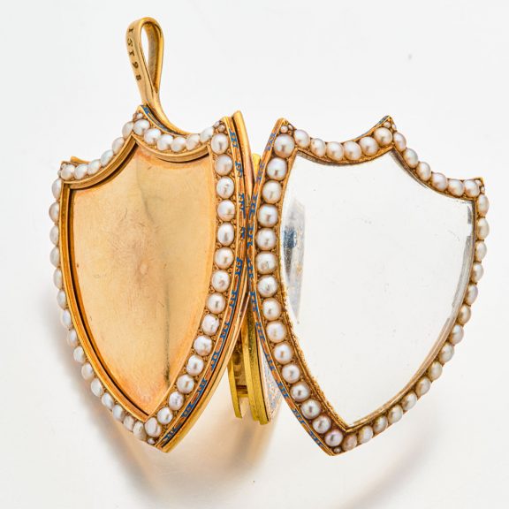 Swiss gold shield shaped watch with visible balance Circa 1800 Swiss gold shield shaped watch with visible balance Circa 1800