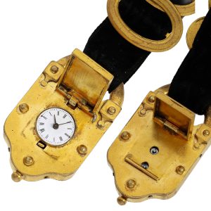 Gold-plated fob watch in the shape of a curtain lock Circa 1820